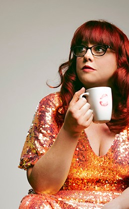 The Quarry Angela Barnes in orange sequinned dress