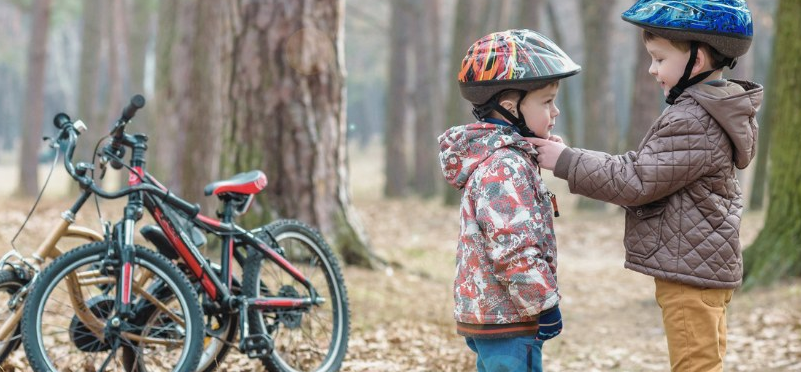 Cycle King kids in woodland with bikes and helmets