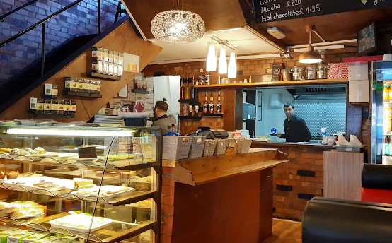 Hallows Cafe counter showing cakes and pastries