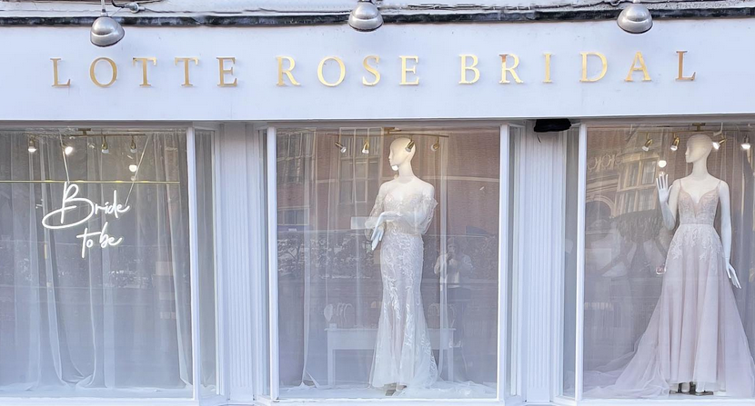 Lotte Rose shopfront wirh manequins in luxury wedding dresses and gold on white facia