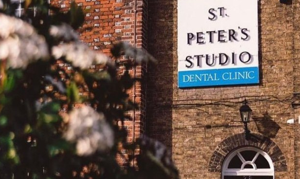 St Peter's building frontage with white, blue and black signage